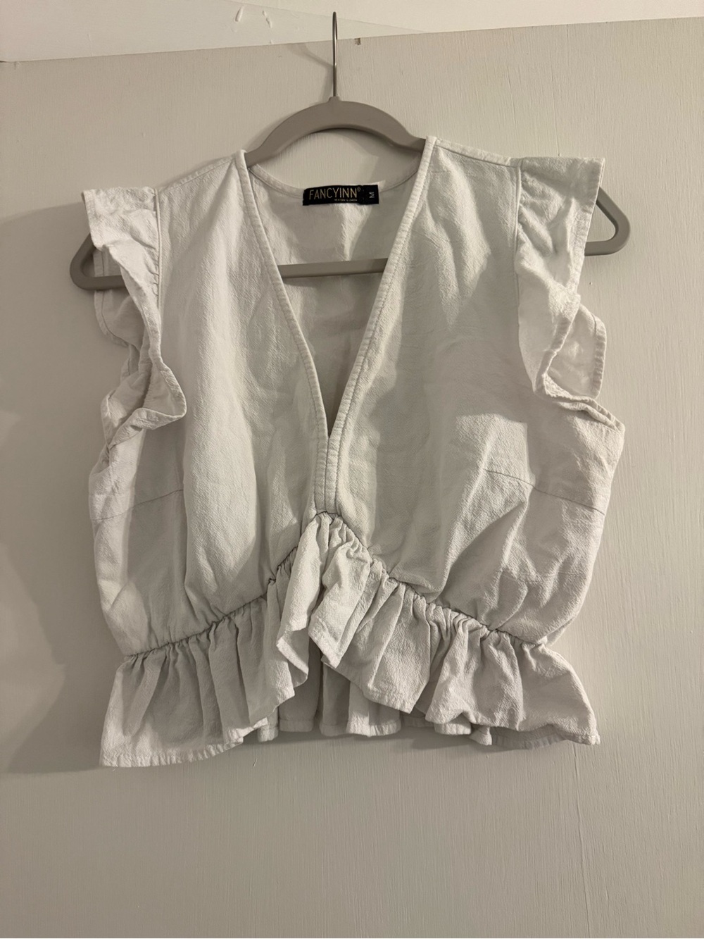 Fancyinn White Ruffle V-Neck Women’s Top